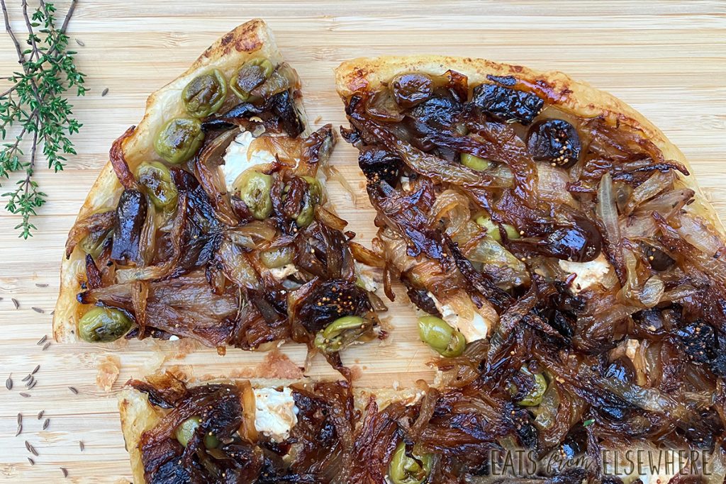 Caramelized onion tarte tatin with goat cheese, figs, and olives