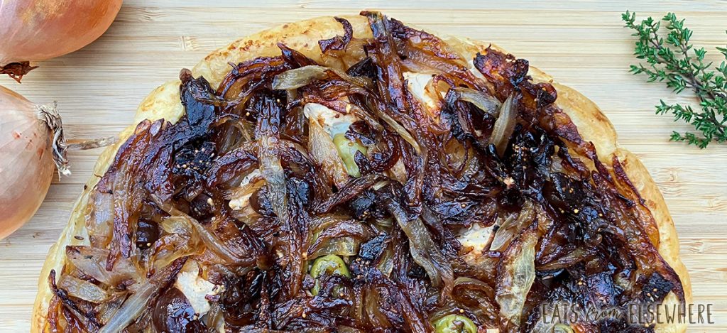 Onion tarte tatin with goat cheese, figs, and olives