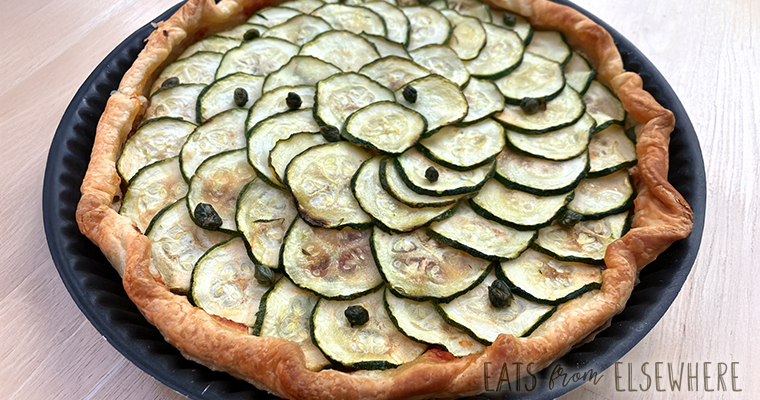 Savory zucchini & ricotta tart with tomato-basil sauce