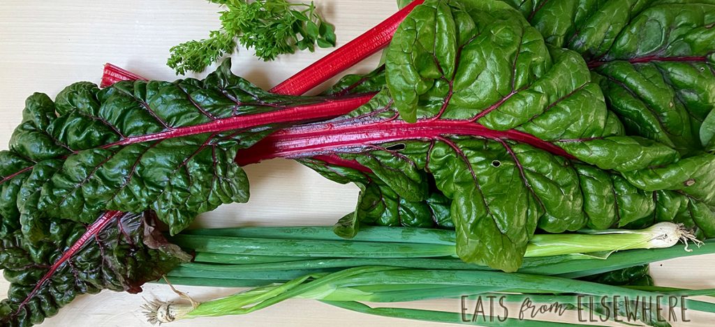 A few of the ingredients here: rainbow chard, scallions, & basil