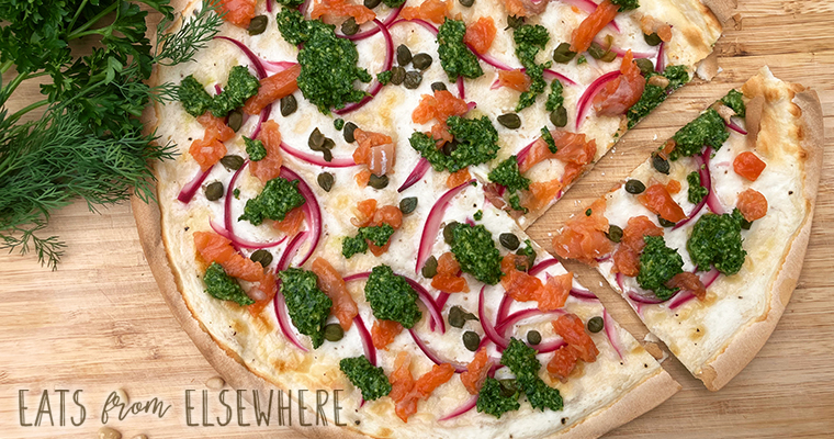 Smoked salmon tarte flambée with dilly-parsley pesto